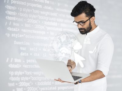 Indian software engineer working on his laptop